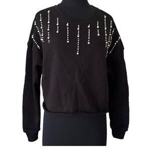 Francesca’s black crewneck sweatshirt with pearl detail